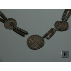 Pendant part of an ornament with a solar cross design